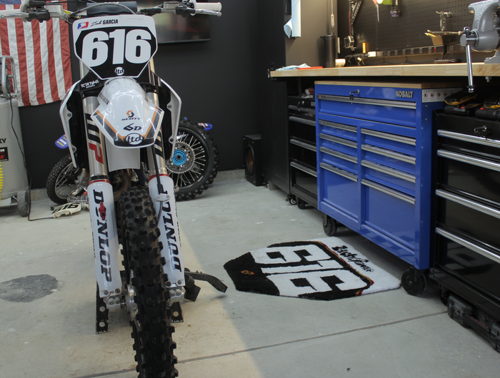 <h4><span style="text-decoration:underline">NEW ARRIVAL</span></h4><h2>Custom Number Plate Garage Rug</h2><p>Upload your number plate and we'll handcraft a one-off rug with a durable non-slip backing. Built for garages, race trailers, motorhomes, and much more.</p>